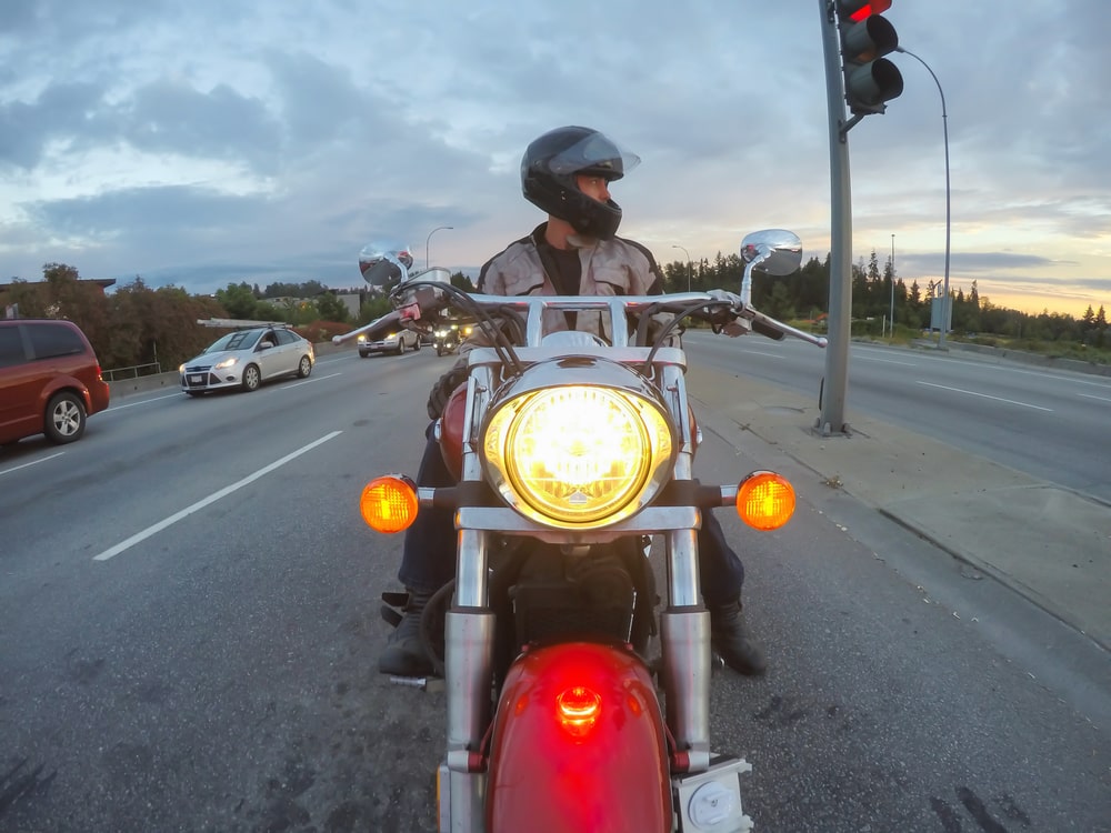 A motorcyclist considers lane splitting in california