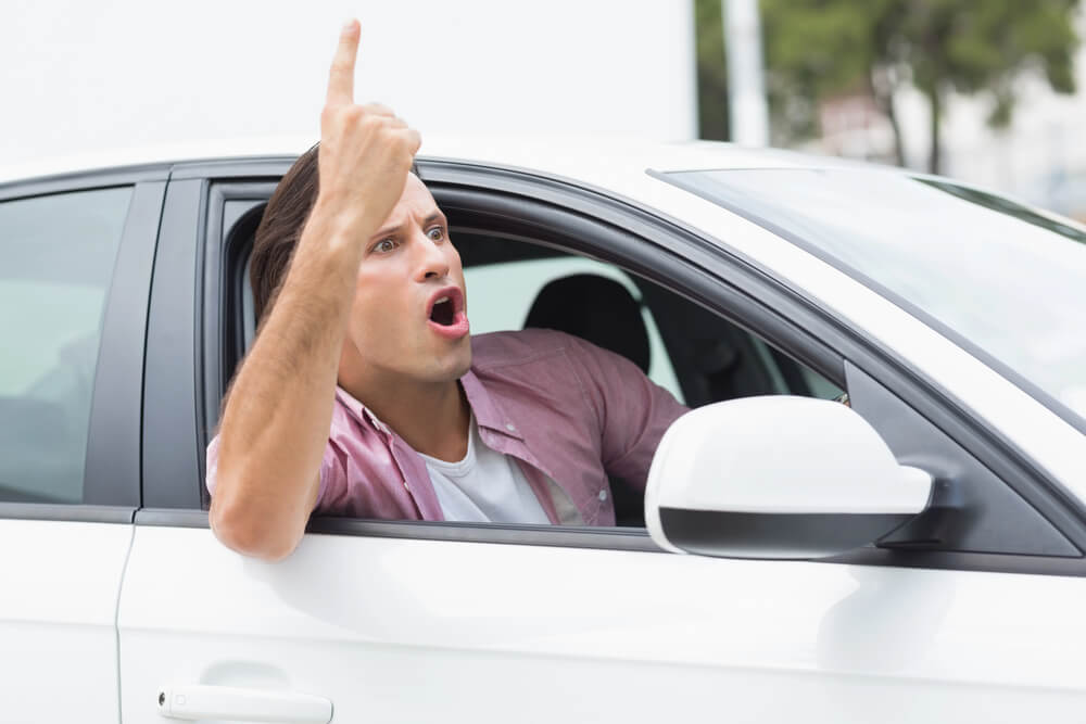 What is the difference between aggressive driving and road rage?