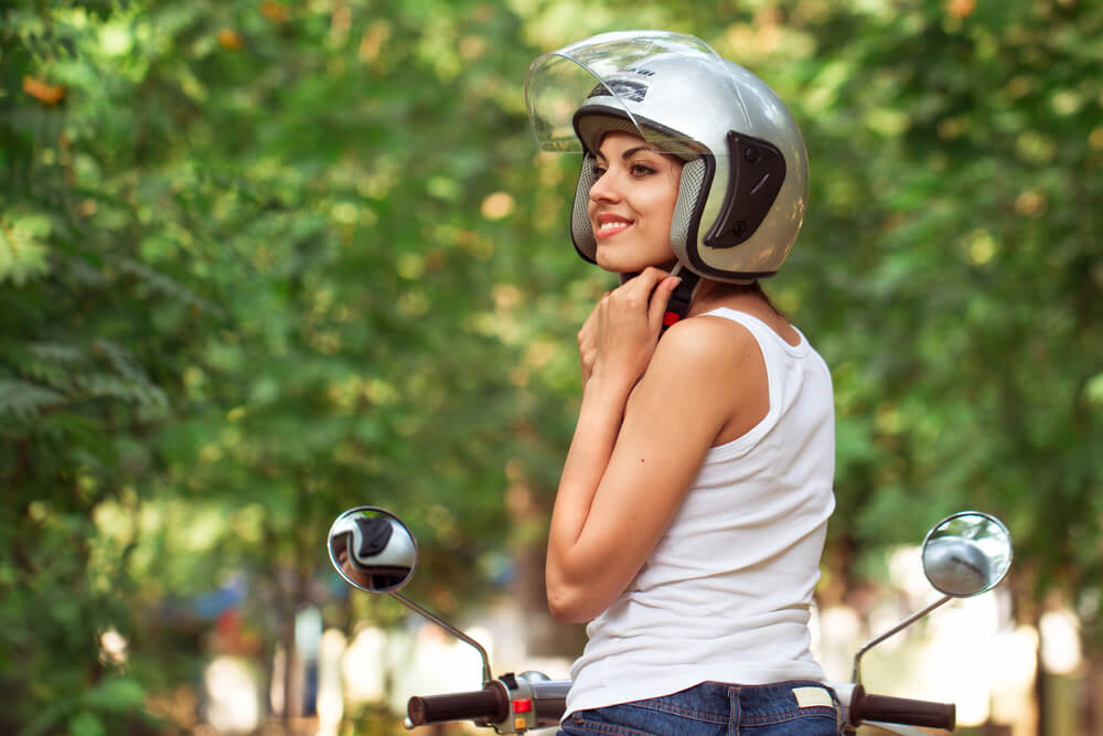 Wearing a helmet can help you stay safe while riding a moped.